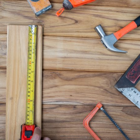 Manual tool set, set on wooden floor. wooden-floor-installation